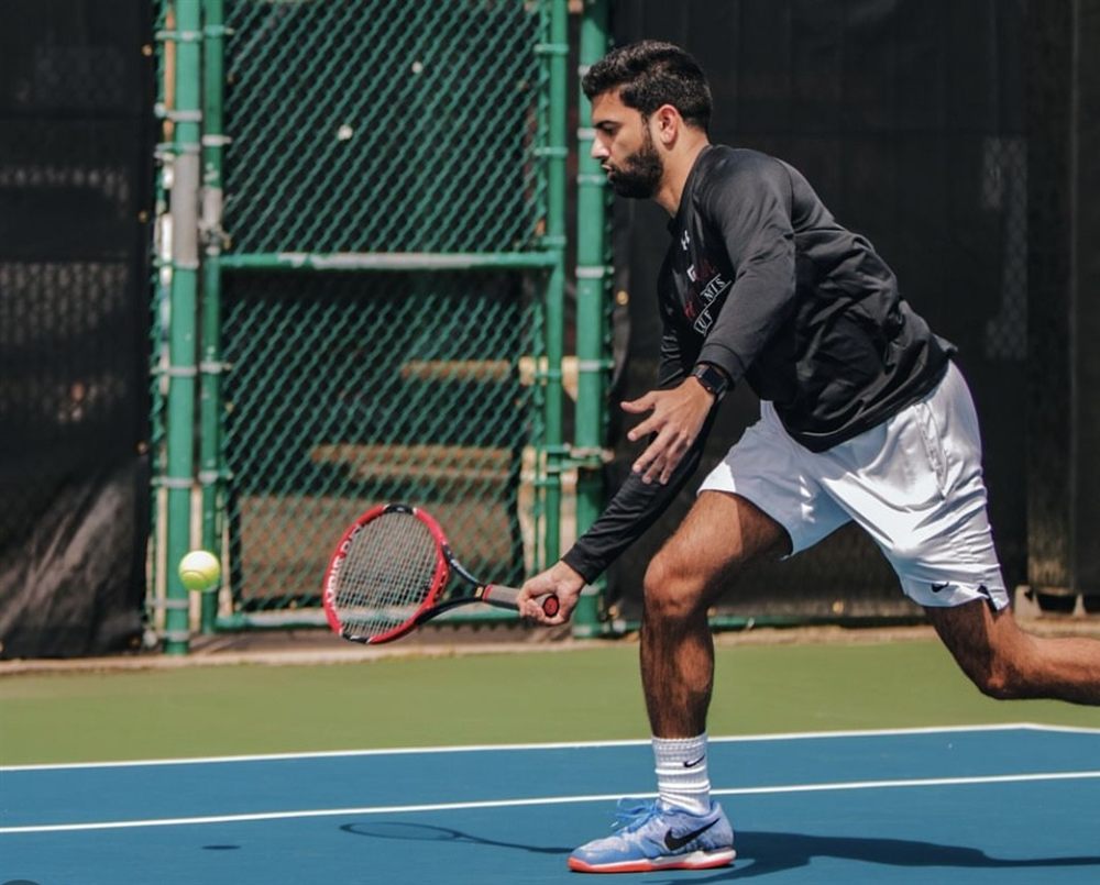 Playing tennis